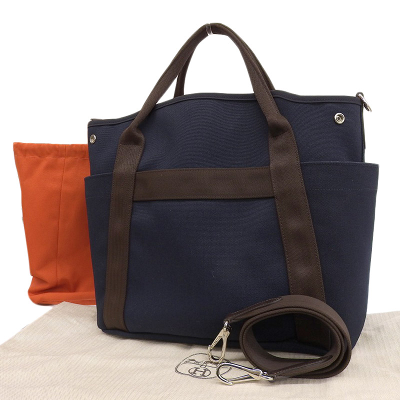 http://エルメス%20HERMES%20サックパンサージュ%202WAYバッグ%20キャンバス/レザー%20ネイビー/オレンジ%20C刻印%202018年%20中古%20HE0897