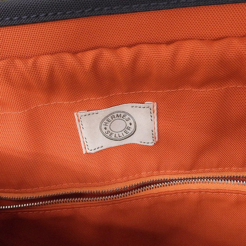 http://エルメス%20HERMES%20サックパンサージュ%202WAYバッグ%20キャンバス/レザー%20ネイビー/オレンジ%20C刻印%202018年%20中古%20HE0897