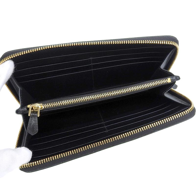 http://プラダ%20PRADA%20長財布%20ラウンドファスナー%20トライアングル%20ジップアラウンド%20サフィアーノ%20レザー%20ブラック%201ML506%20中古%20OBB0548
