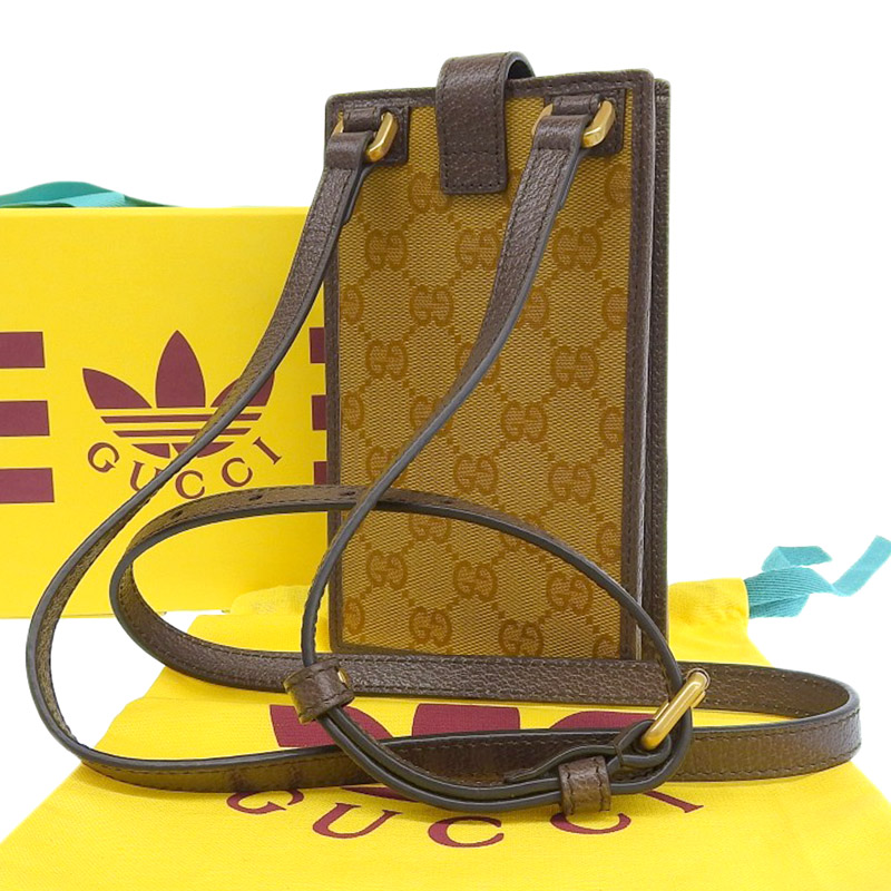 http://グッチ%20GUCCI%20アディダスコラボ%20GGクリスタル%20スマホショルダー%20PVC/レザー%20ブラウン/ホワイト%20702203%20美品%20GU0583