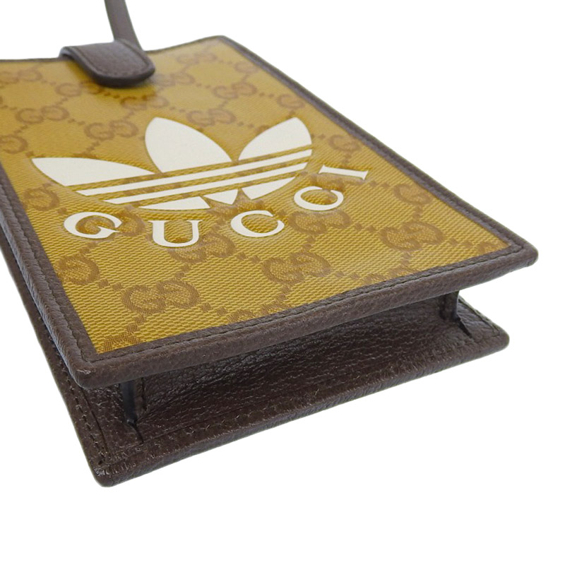 http://グッチ%20GUCCI%20アディダスコラボ%20GGクリスタル%20スマホショルダー%20PVC/レザー%20ブラウン/ホワイト%20702203%20美品%20GU0583