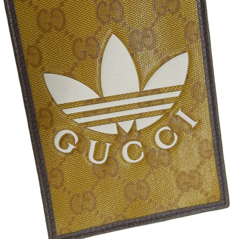 http://グッチ%20GUCCI%20アディダスコラボ%20GGクリスタル%20スマホショルダー%20PVC/レザー%20ブラウン/ホワイト%20702203%20美品%20GU0583