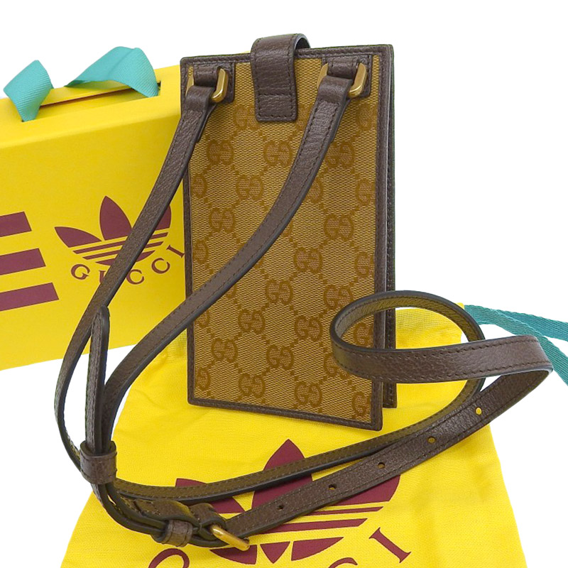 http://グッチ%20GUCCI%20アディダスコラボ%20GGクリスタル%20スマホショルダー%20PVC/レザー%20ブラウン/ホワイト%20702203%20美品%20GU0584