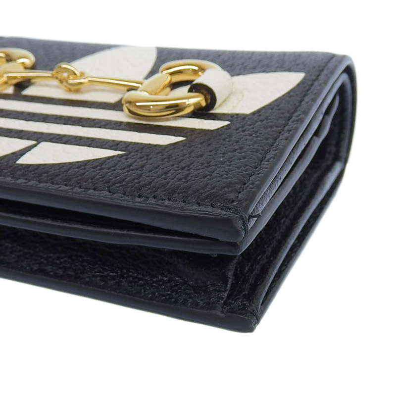 http://グッチ%20GUCCI%20アディダスコラボ%20ショルダーウォレット%20レザー%20ブラック/ホワイト%20702248%20美品%20GU0585