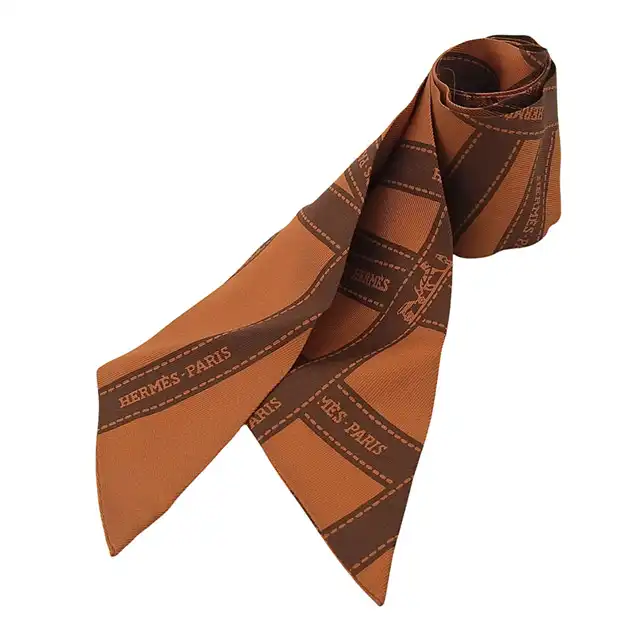 http://エルメス%20HERMES%20ボルデュックリボン%20ツイリー%20スカーフ%20シルク%20オレンジ/ブラウン%20中古%20HE1176